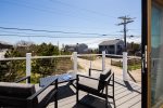 Enjoy gorgeous views and bay breezes from the deck off the primary